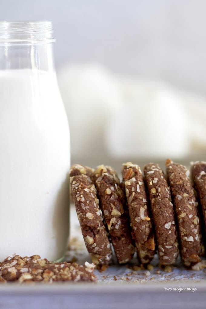 cookies and milk lined up on a baking pan