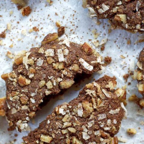 broken German chocolate cookie on parchment paper