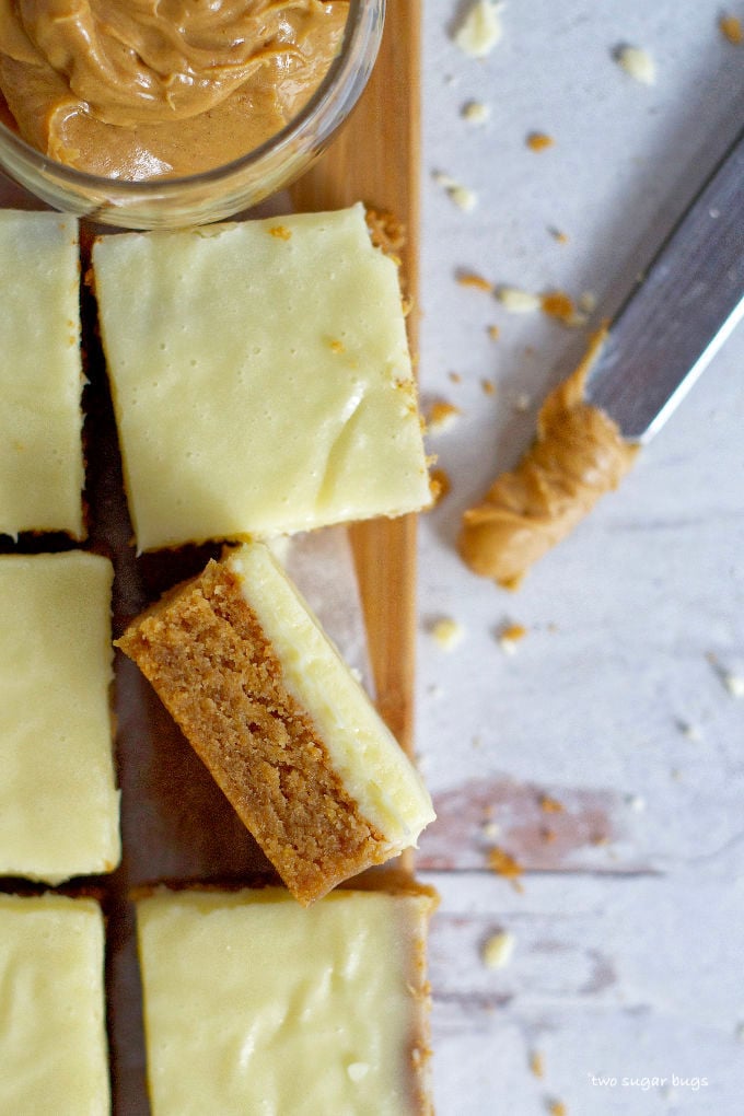 close up of a peanut butter white chocolate blondie on it's side