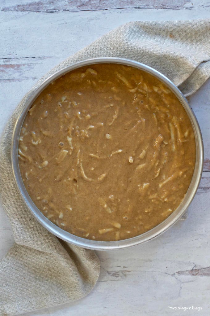 spiced apple cake batter in a baking pan