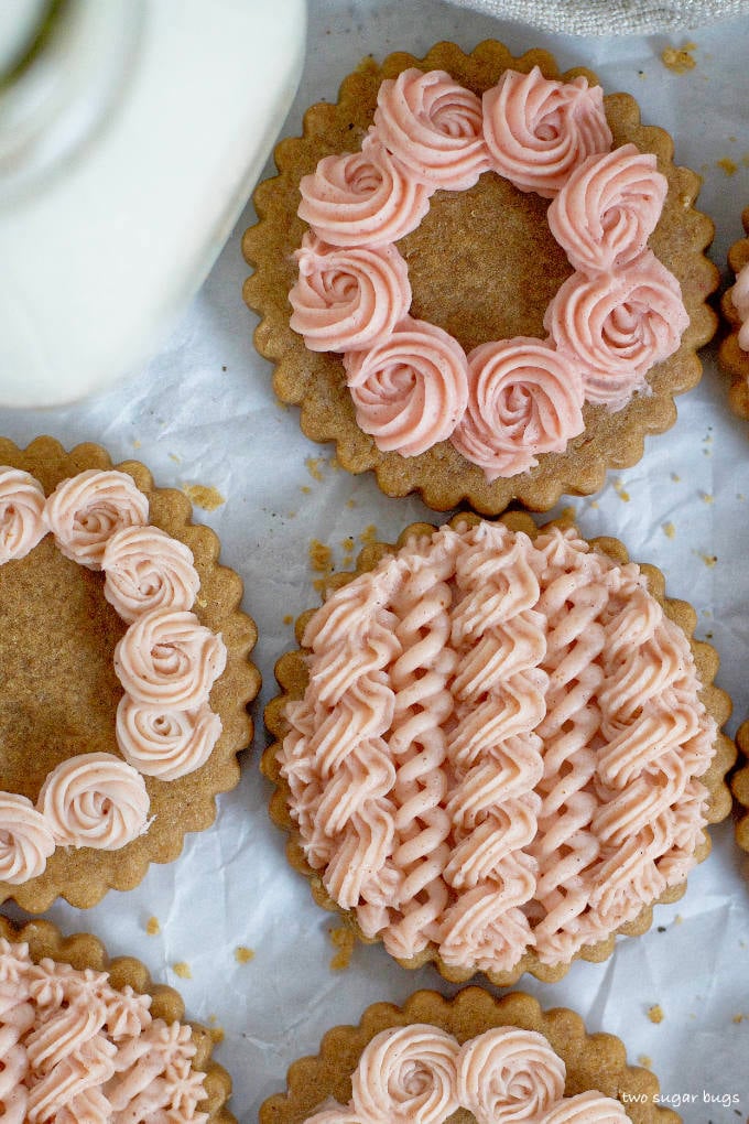 close up of gingerbread cookies with pink frosting