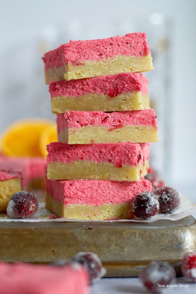 stack of five orange cranberry sugar cookies bars on a baking sheet