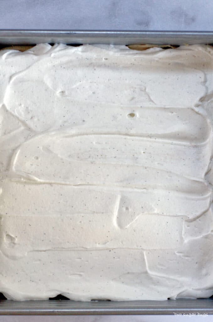 whipped cream layer on top of tom and jerry's dessert tiramisu