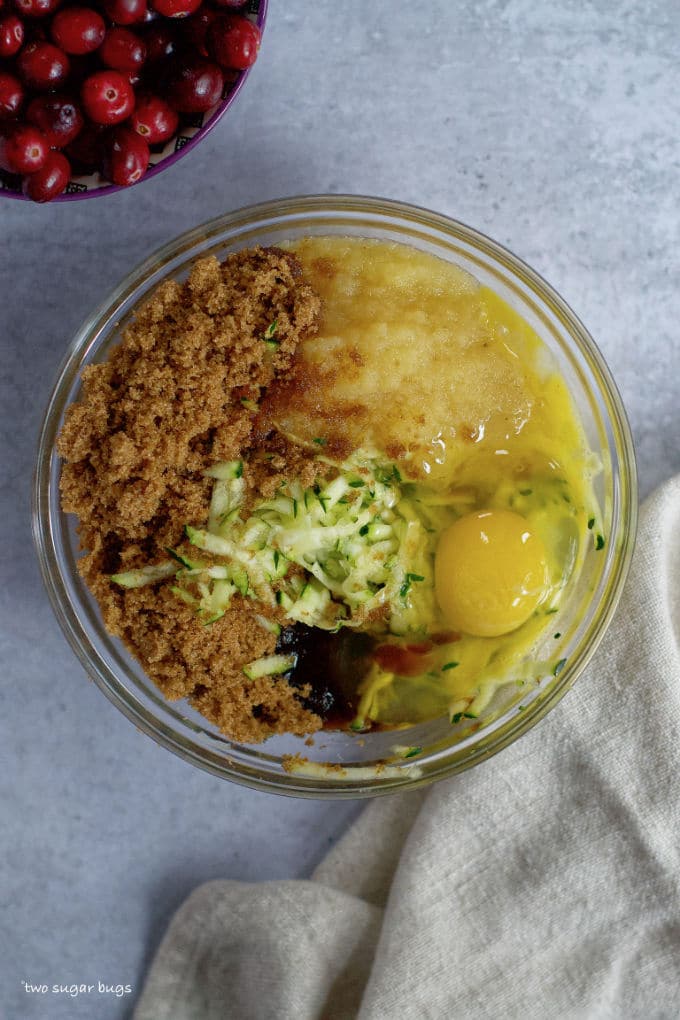 brown sugar, shredded zucchini, applesauce, egg and vanilla in a bowl
