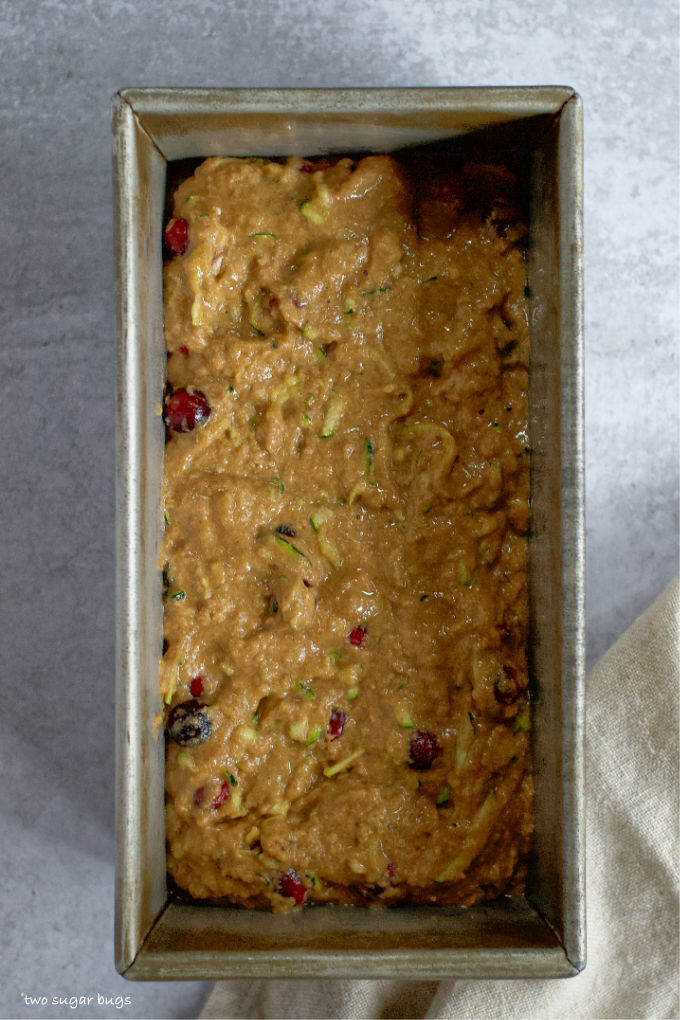 cranberry zucchini bread batter in a baking pan