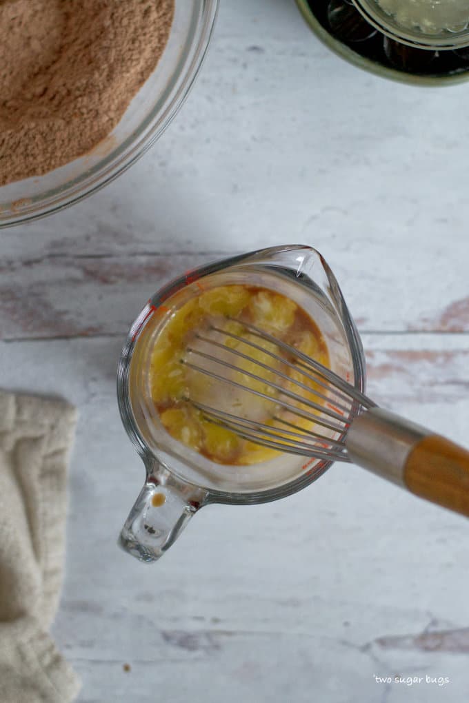 milk, vanilla and melted butter in a measuring cup with a whisk