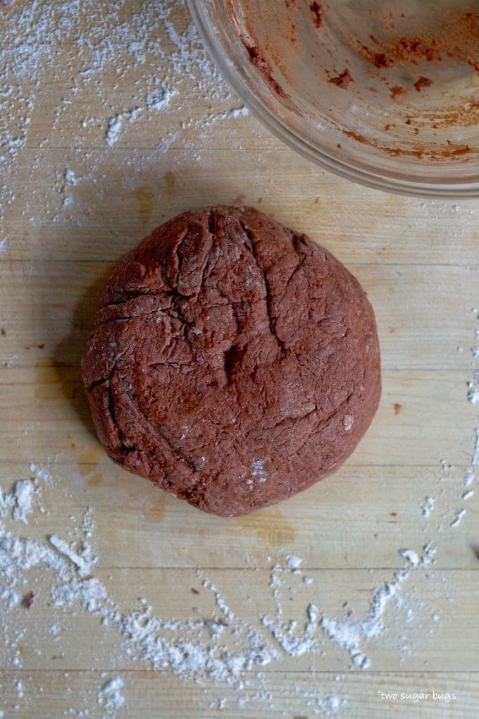 chocolate dough slightly kneaded into a ball on a cutting board