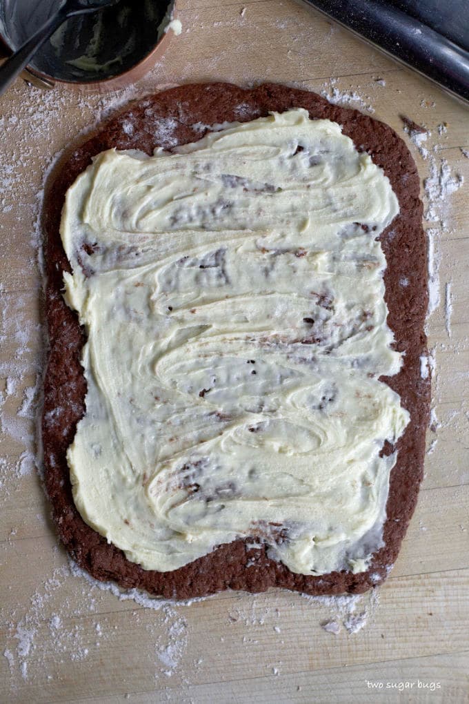 melted white chocolate spread over chocolate dough