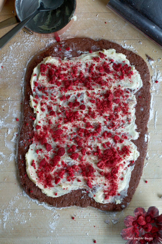chocolate dough with white chocolate and raspberries spread over the top