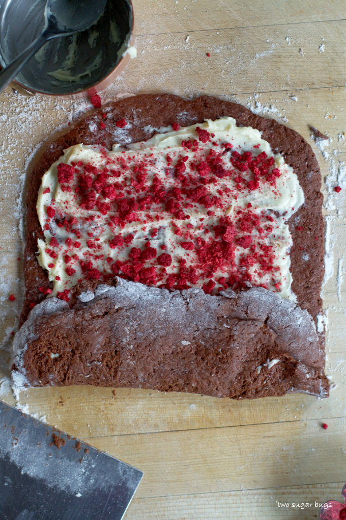 bottom portion of chocolate dough folded over white chocolate and raspberry filling