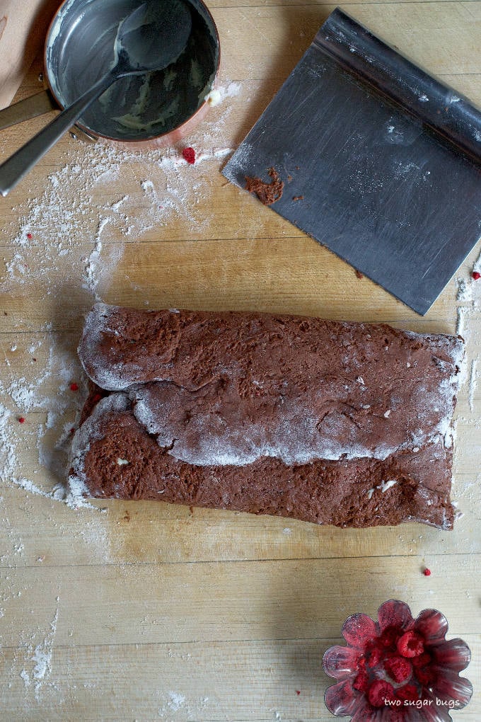 chocolate dough filled and folded over on a cutting board