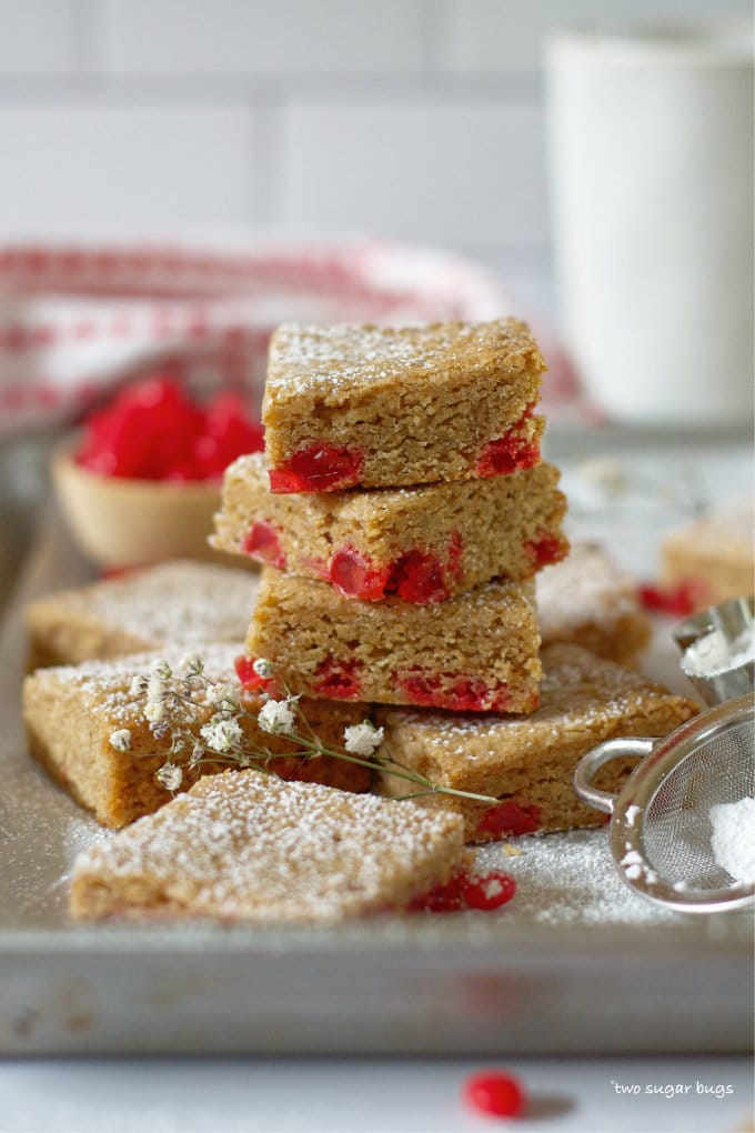stack of red hot cinnamon cookie bars on a baking pan