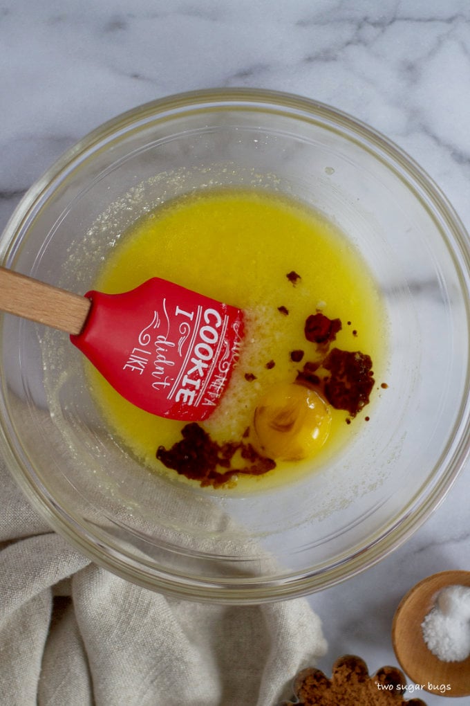 butter, sugars, vanilla, egg yolk and red food coloring in a mixing bowl