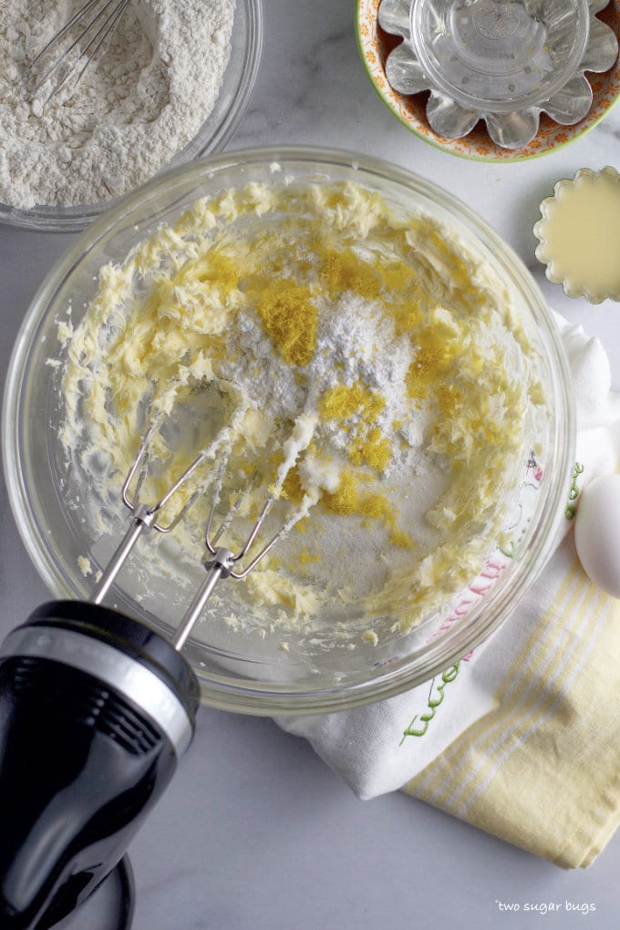 sugars and zest added to creamed butter in a mixing bowl