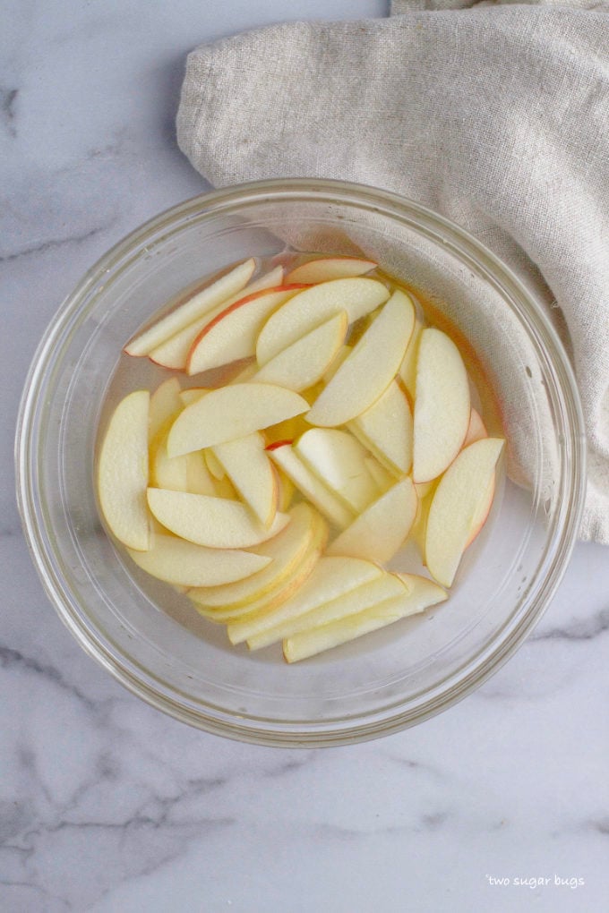 sliced apples in a citrus bath