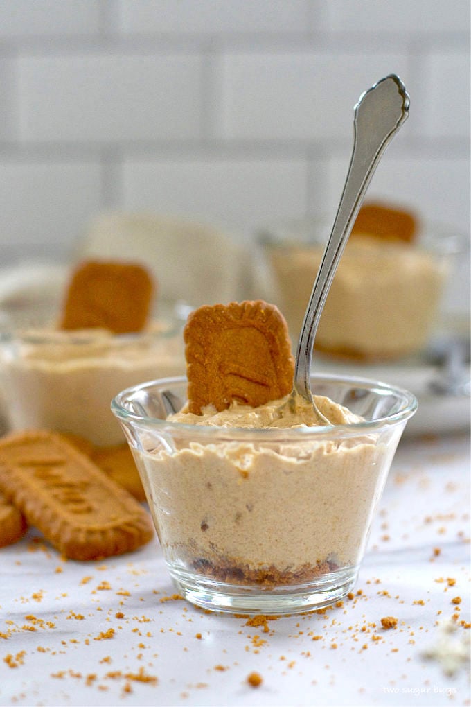 spoon standing up in a serving of biscoff cookie mousse