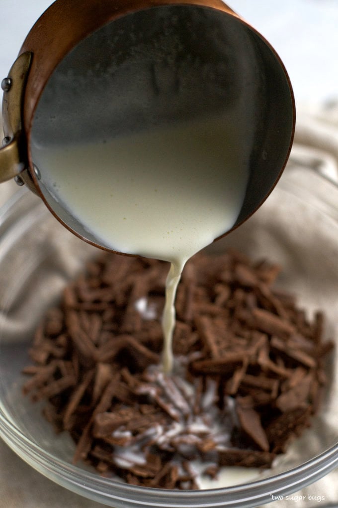 heavy cream being poured over milk chocolate