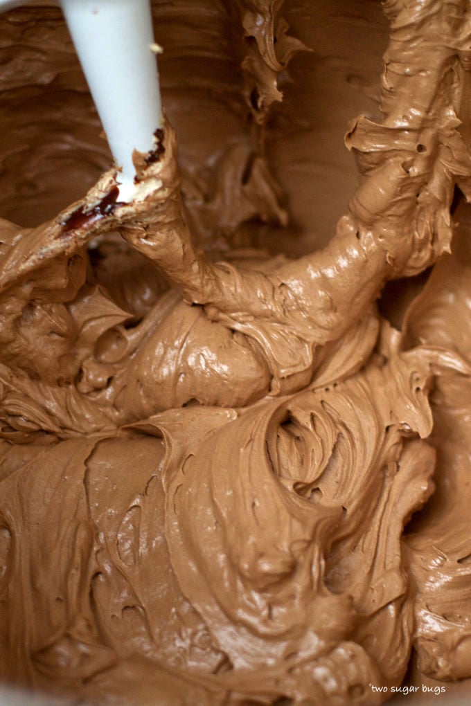 silky chocolate swiss meringue buttercream in the mixing bowl