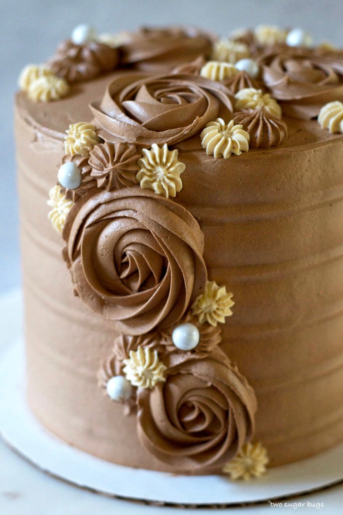 cake decorated with chocolate swiss meringue buttercream