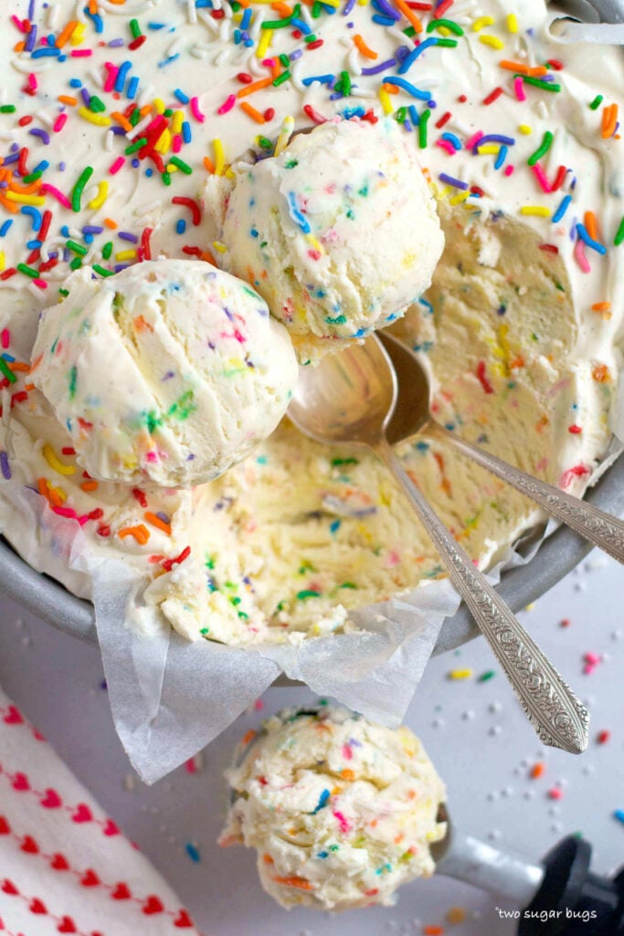 three scoops of funfetti ice cream with two spoons