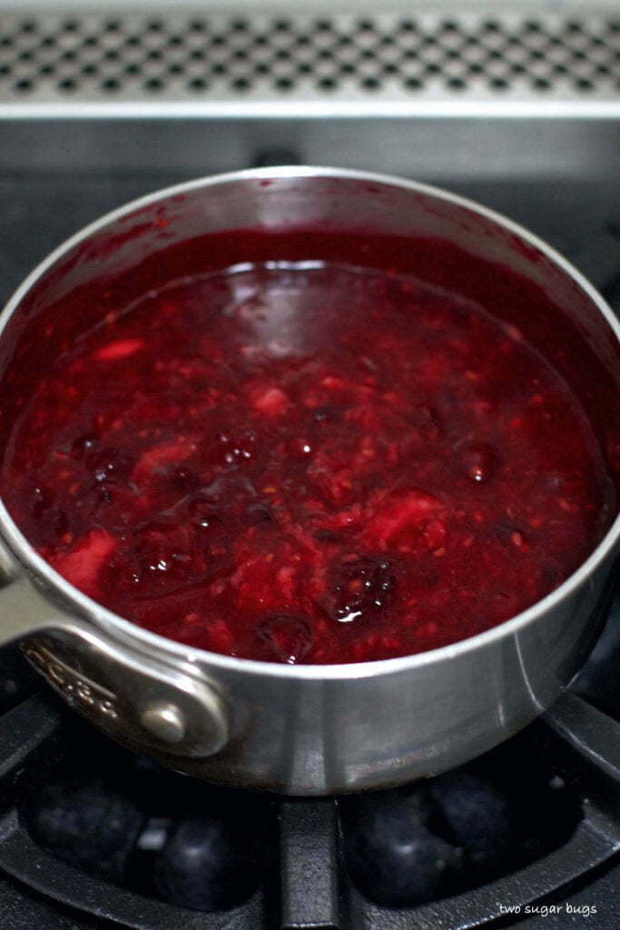 mixed berries cooking in a saucepan