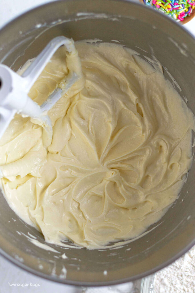 butter, sugar, eggs and cream cheese mixed to a batter in the mixing bowl