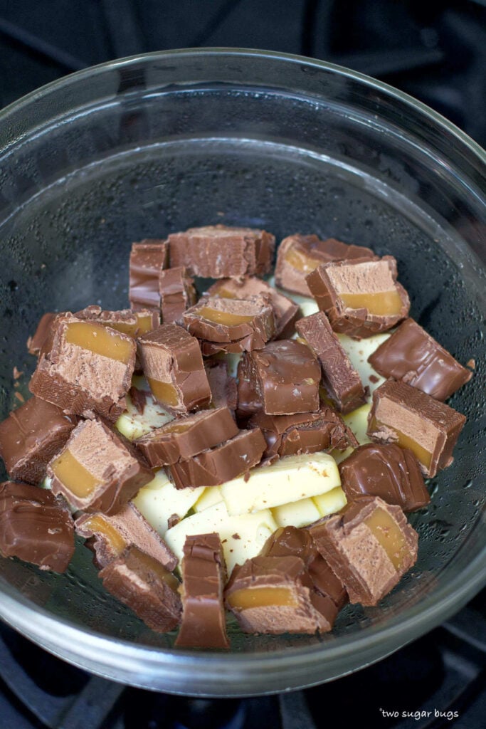 chopped Milky Way bars and butter in a pot over simmering water