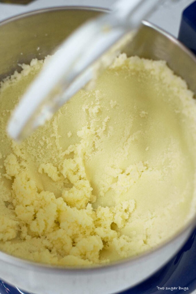 butter and sugar pressed up against the side of the mixing bowl