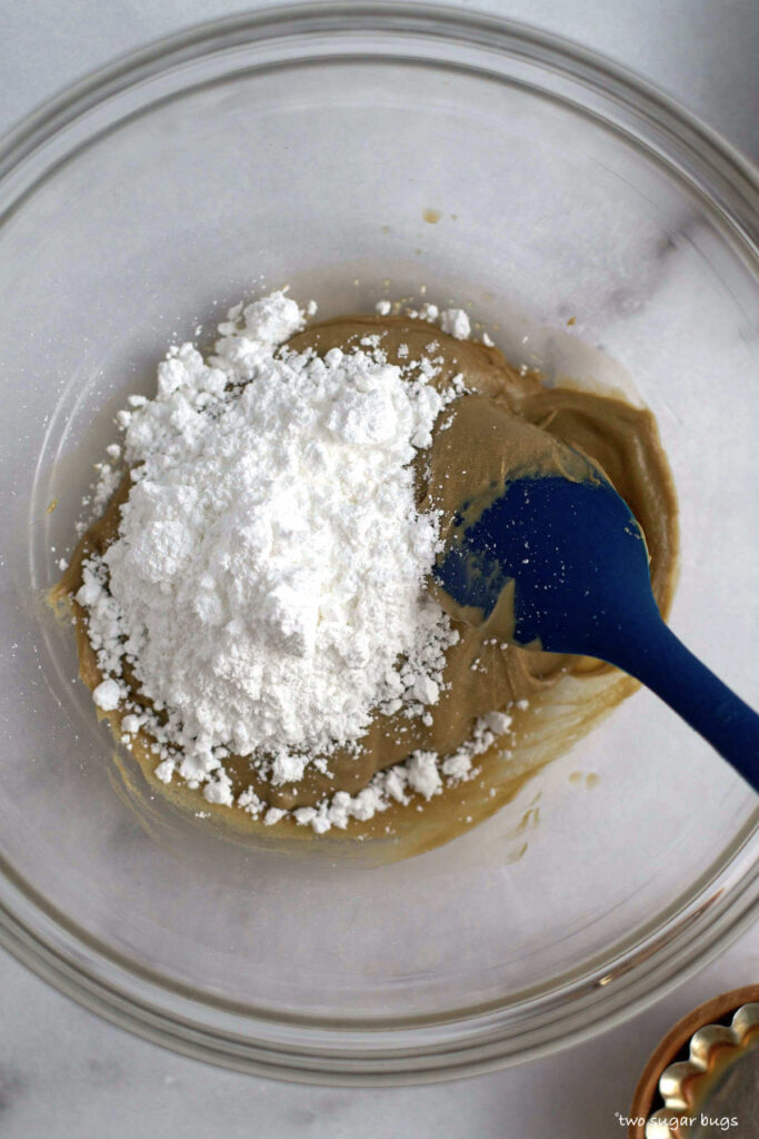 confectioners' sugar on top of SunButter in a bowl