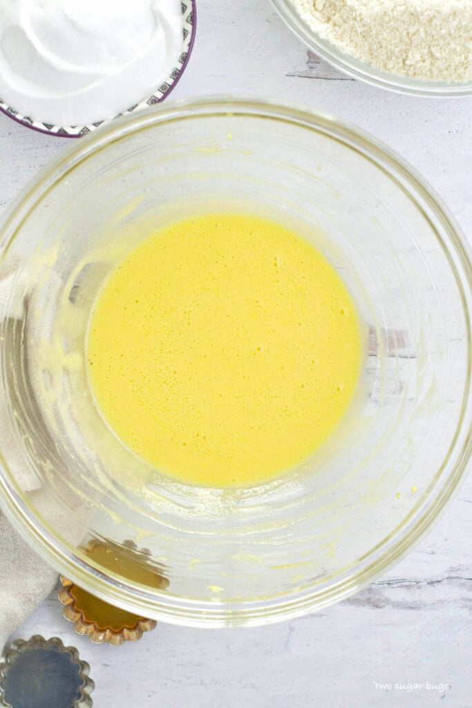 egg yolks whipped in a glass bowl