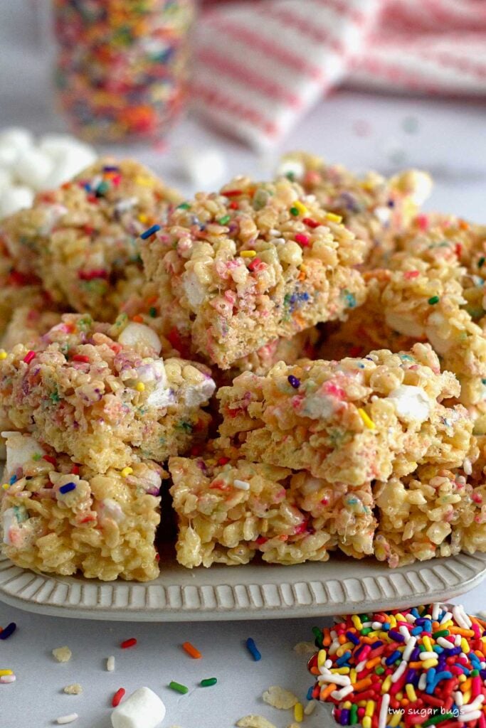 a plate filled with sprinkle Rice Krispie treats