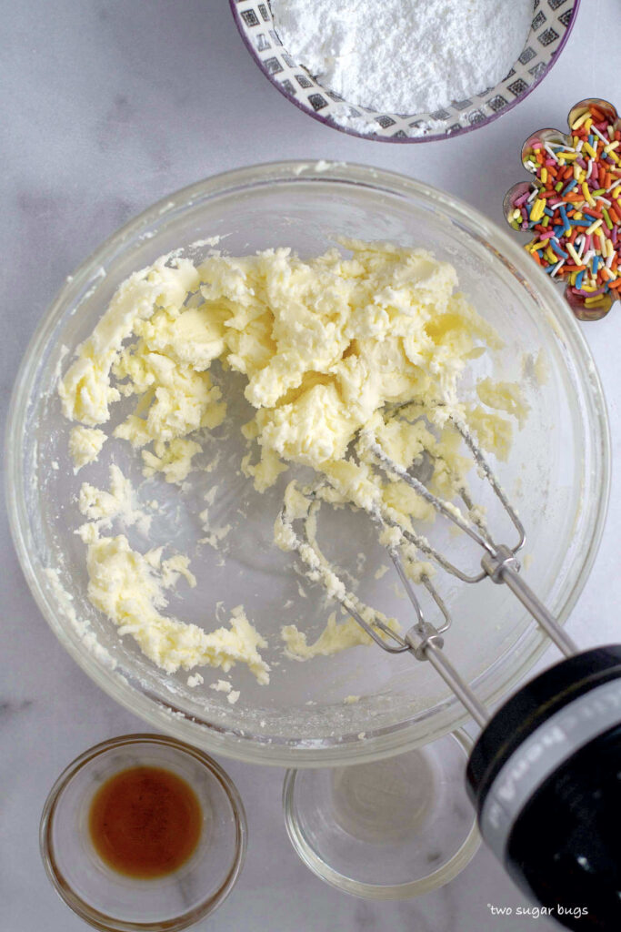 creamed butter and confectioners' sugar in a bowl