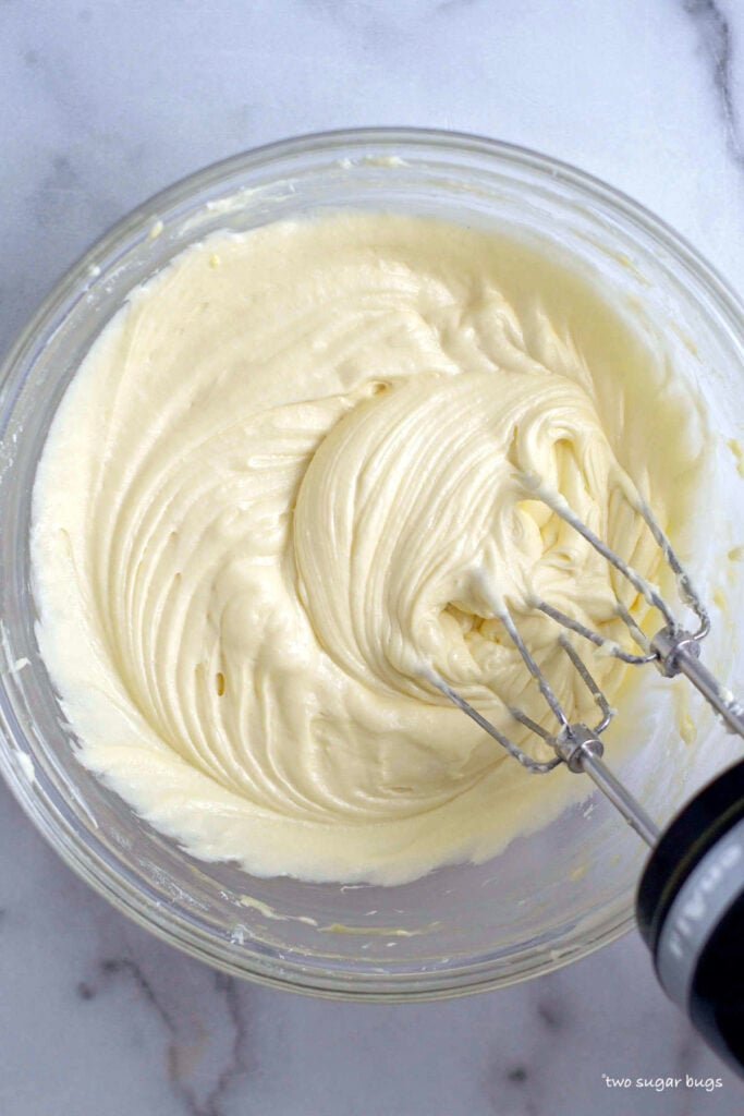 butter, cream cheese, sugars, eggs and extract in a mixing bowl
