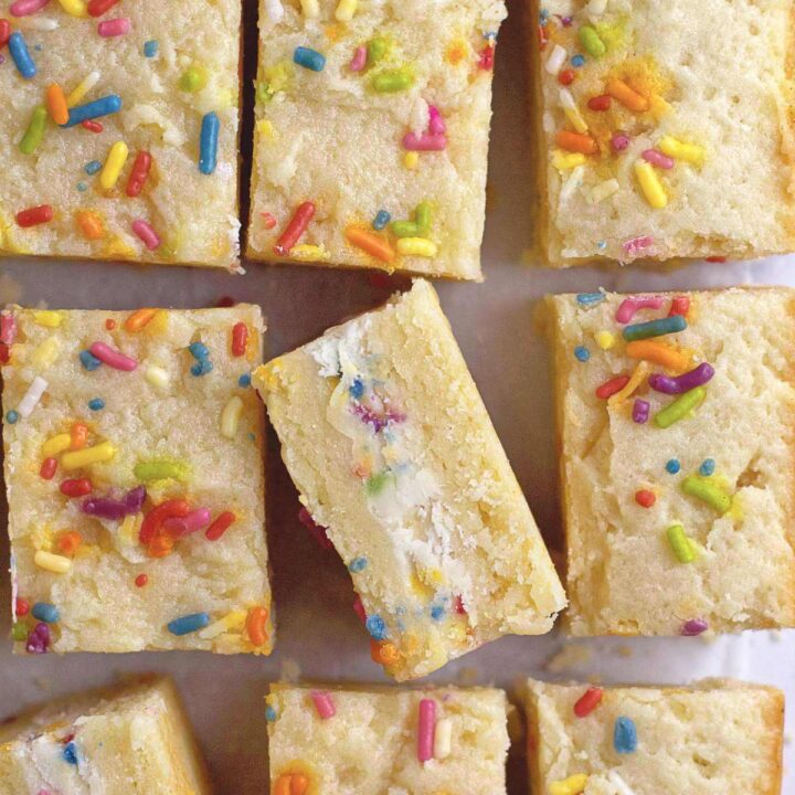close look at the funfetti frosting stuffed inside sugar cookie sandwiches