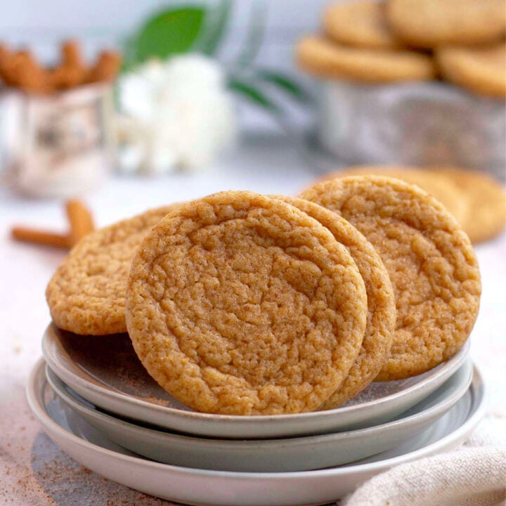 apple cider sugar cookies piled on a plate