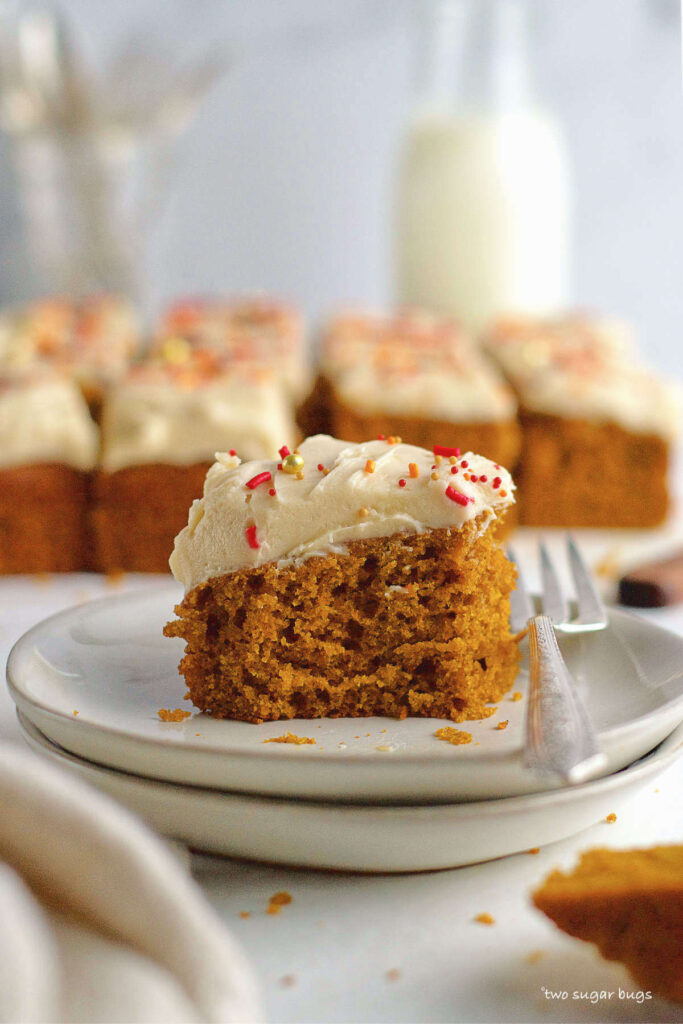 slice of pumpkin cake on a plate with a fork
