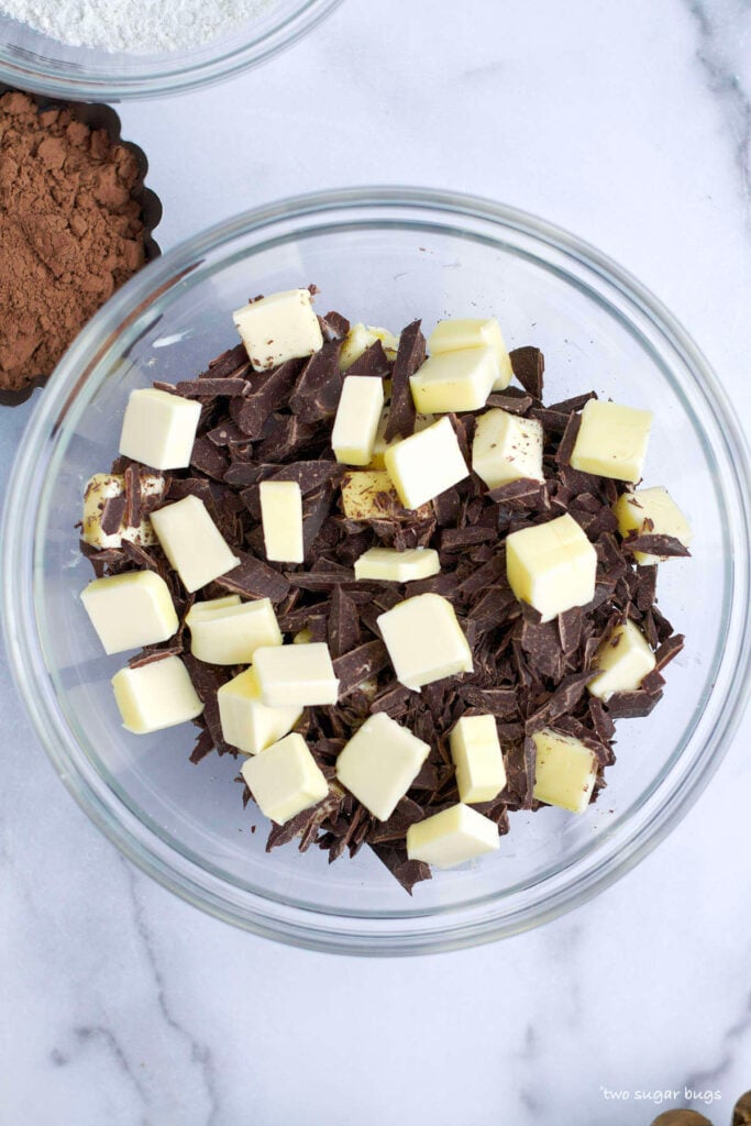 chopped semi sweet chocolate and butter in a glass bowl
