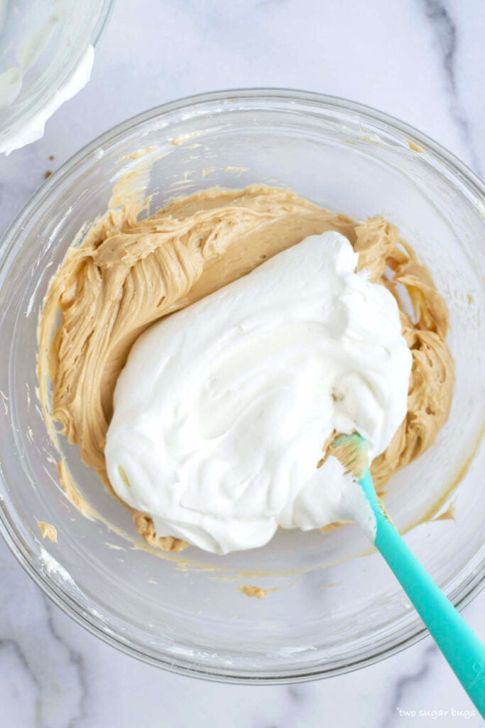 whipped cream added to cookie butter and cream cheese