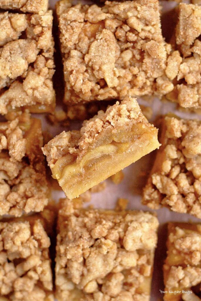 inside view of shortbread layer, apple pie filling, buttery almond crumb topping