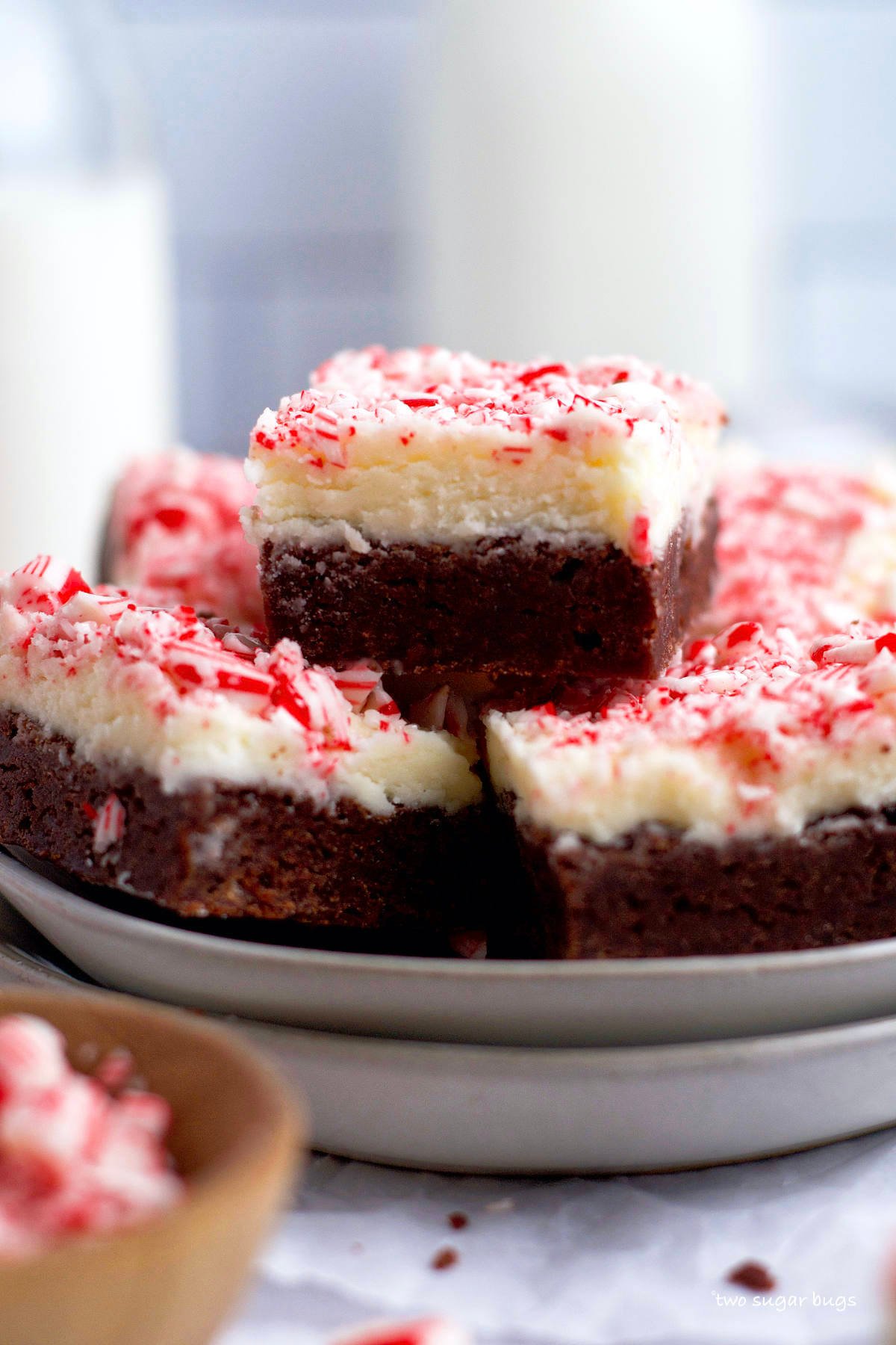 frosted peppermint brownies on a plate