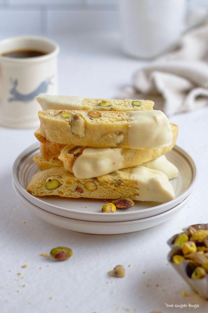 lemon pistachio biscotti stacked on a plate