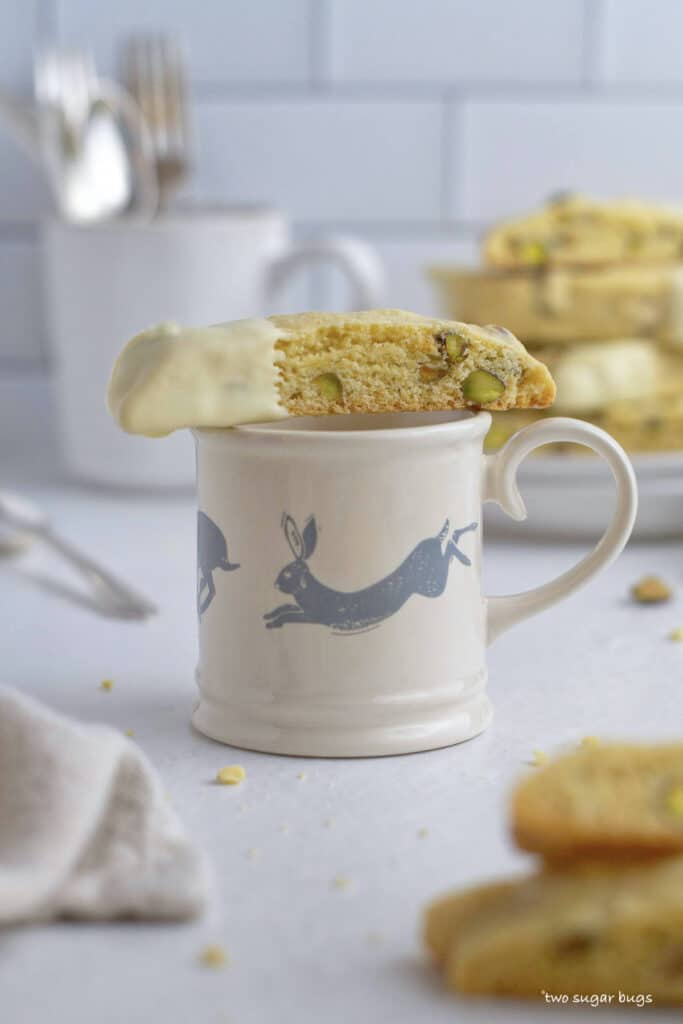 biscotti cookie sitting on top of a coffee mug