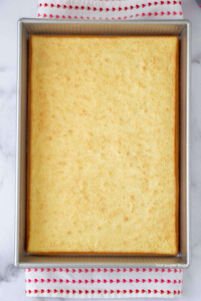 baked almond sponge in a baking pan