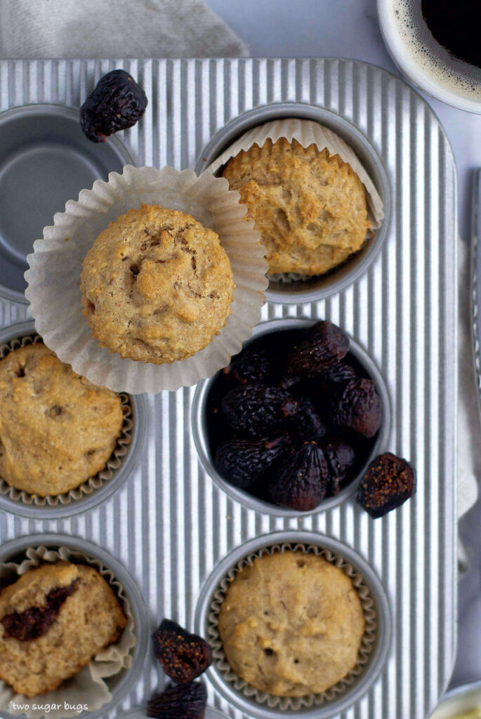 baked muffins in a tin with dried figs