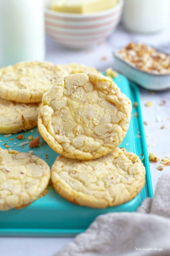 white chocolate coconut cookies on a baking tray