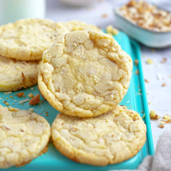 white chocolate coconut cookies on a baking tray