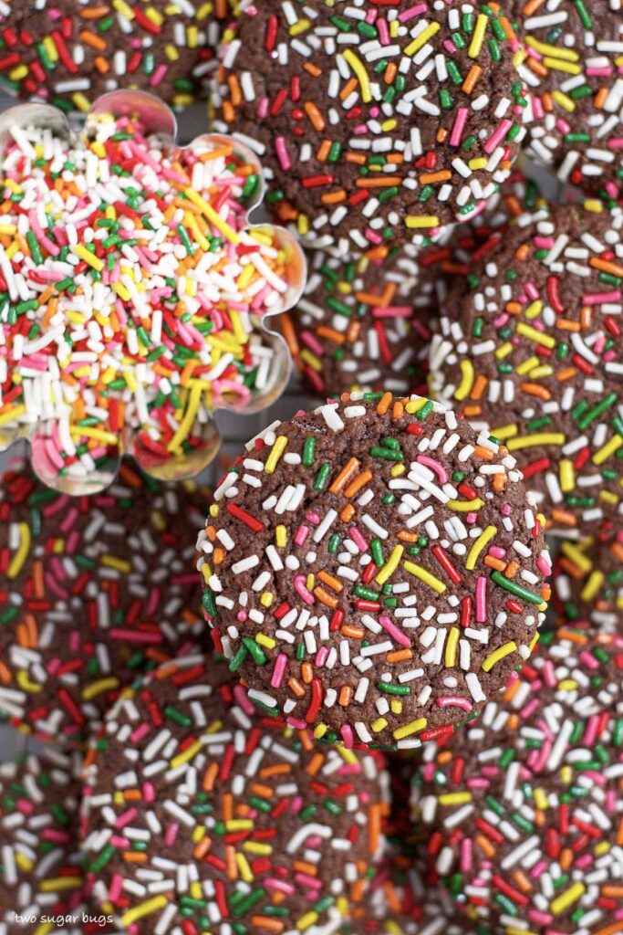 sprinkle covered chocolate cookies in a pile