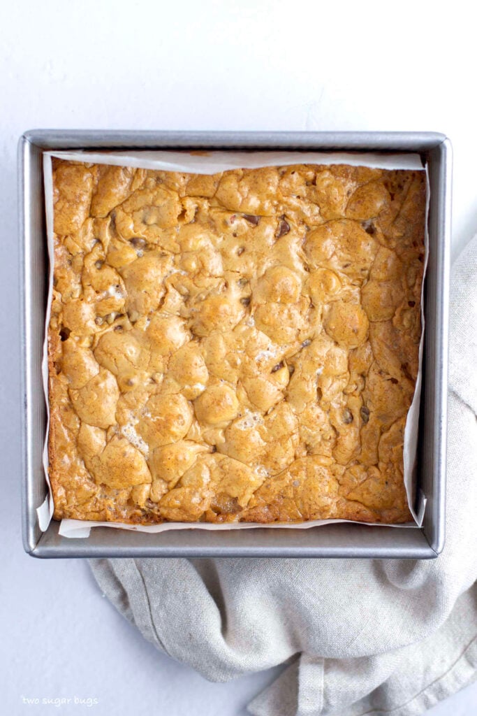baked nordy bars in a parchment lined baking pan
