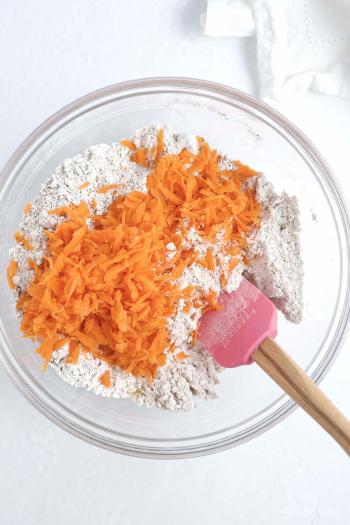 dry ingredients with grated carrots on top