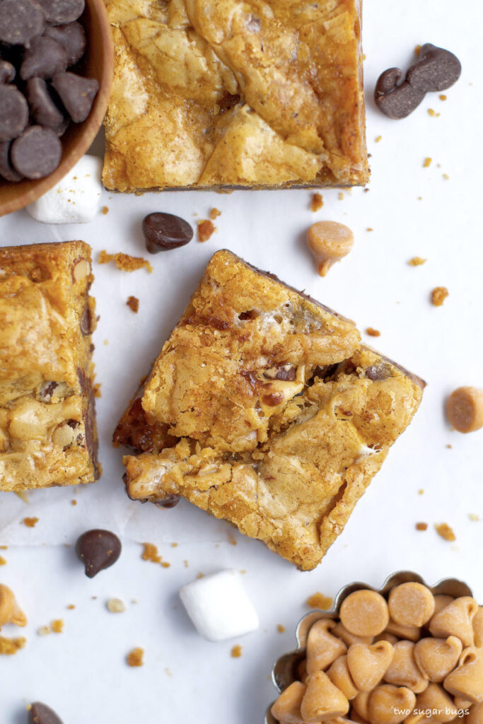 an overhead look at the gooey top of a nordy bar with chocolate chips and butterscotch chips